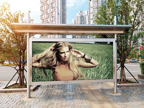 Outdoor advertising display featuring a large vibrant image printed on the Mimaki JV100 printer.